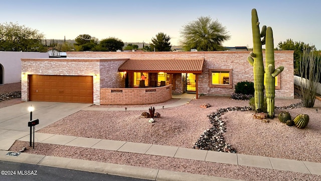 view of front of property with a garage