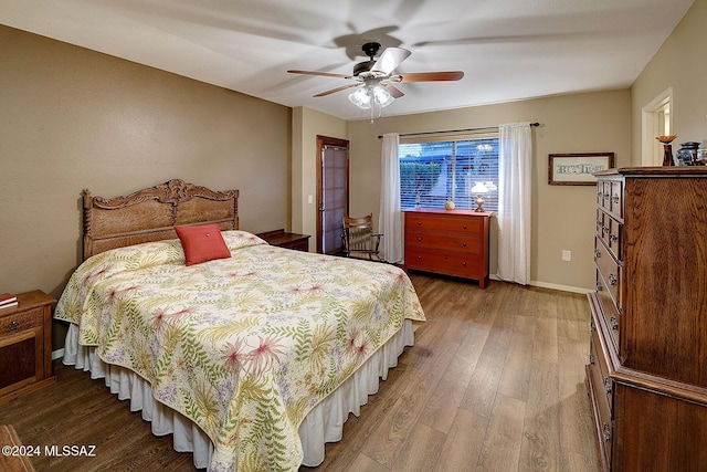 bedroom featuring ceiling fan and light wood-type flooring