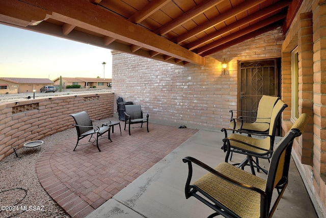 view of patio terrace at dusk