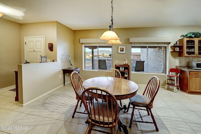 dining space featuring light tile patterned floors