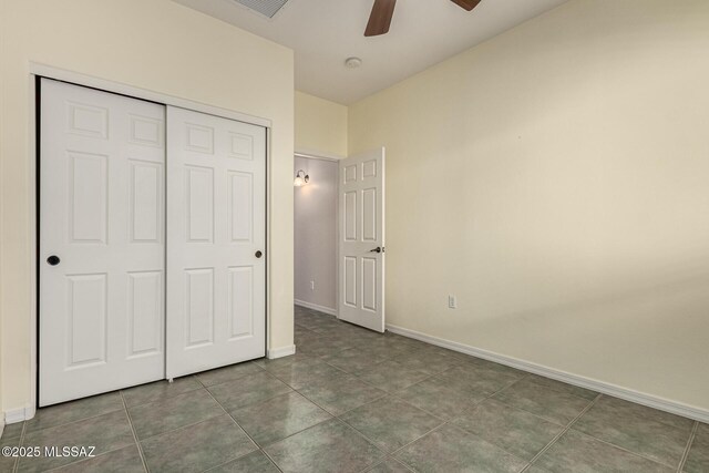 bathroom with tile patterned floors and a shower with door