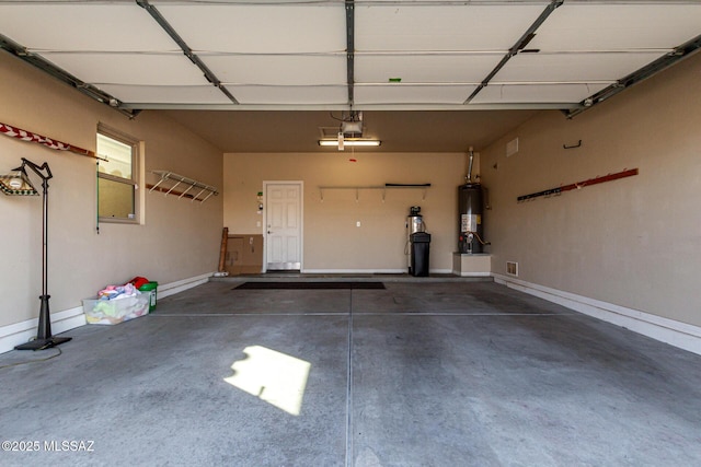 garage with a garage door opener and water heater