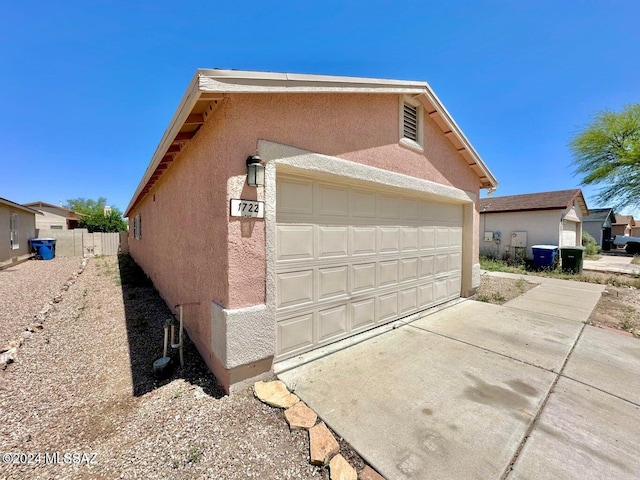 view of side of home featuring a garage