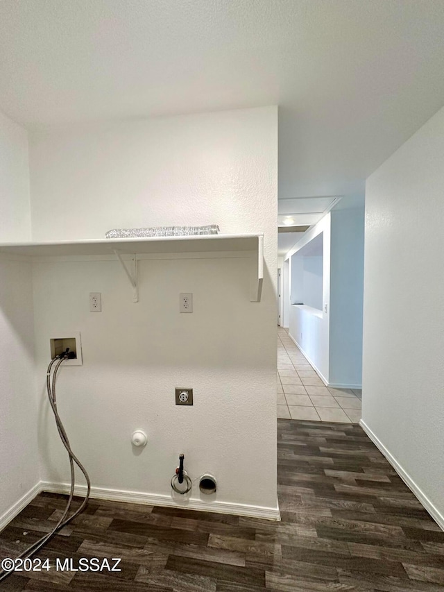 laundry room with washer hookup, hookup for a gas dryer, hookup for an electric dryer, and dark hardwood / wood-style flooring