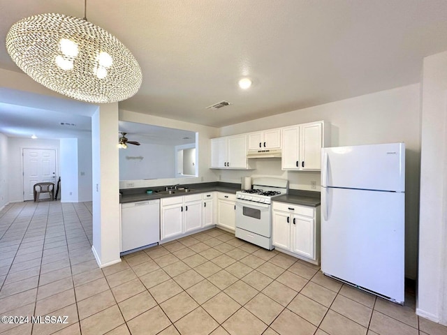 kitchen featuring white appliances, white cabinets, ceiling fan with notable chandelier, sink, and hanging light fixtures