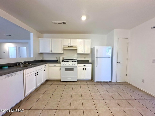 kitchen with white cabinetry, white appliances, sink, and light tile patterned floors