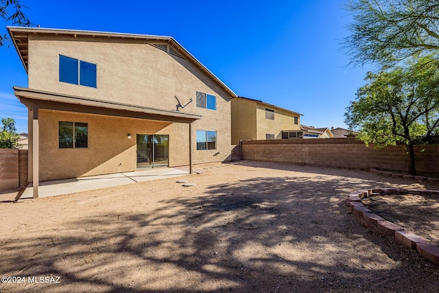 back of house featuring a patio