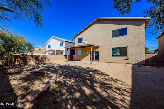 back of house featuring a patio area