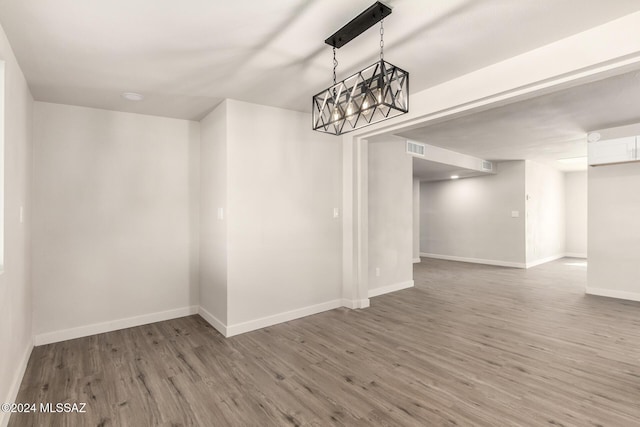 unfurnished dining area featuring dark hardwood / wood-style floors