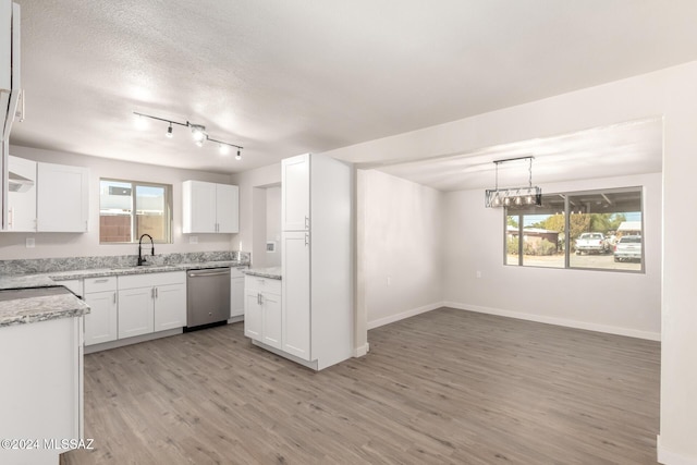 kitchen with white cabinets, dishwasher, light wood-type flooring, and plenty of natural light