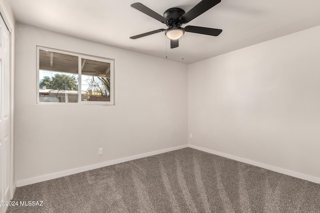 spare room with carpet flooring and ceiling fan