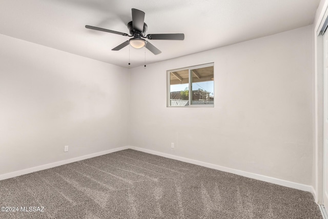 spare room featuring carpet and ceiling fan