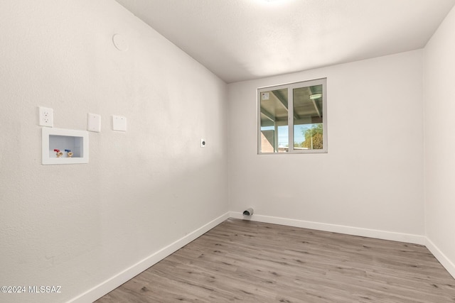 laundry room with hookup for a washing machine, electric dryer hookup, and wood-type flooring