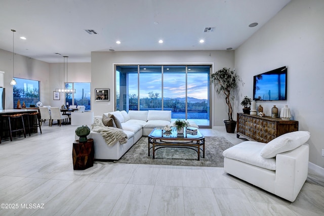 living room with a notable chandelier