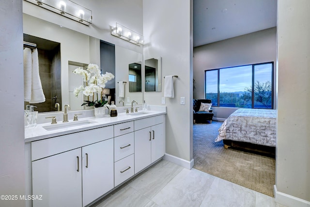 bathroom featuring vanity and a shower with shower door