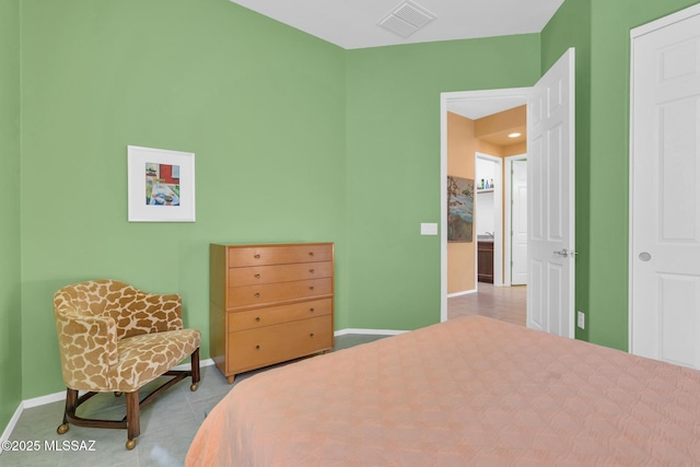 bedroom featuring light tile patterned floors