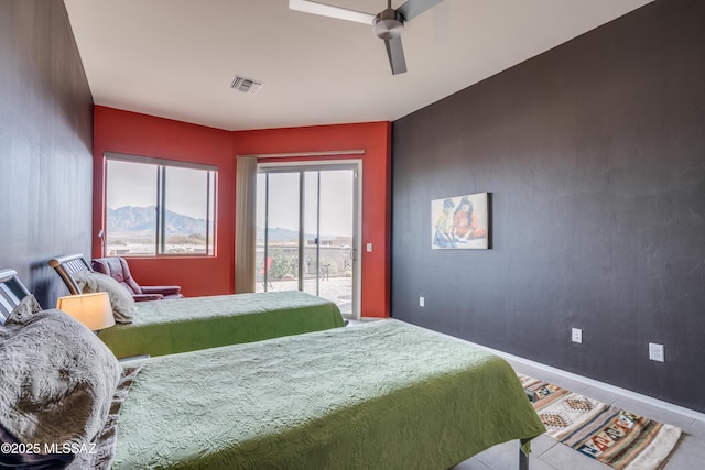 bedroom with ceiling fan and access to outside