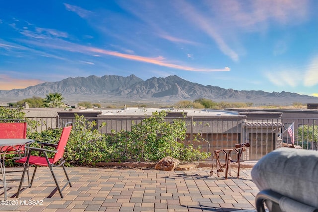 view of patio / terrace with a mountain view