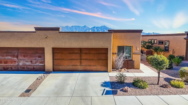 adobe home featuring a mountain view