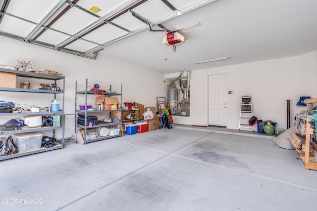 garage featuring gas water heater and a garage door opener