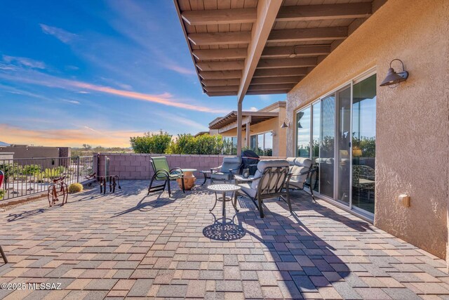 view of patio terrace at dusk