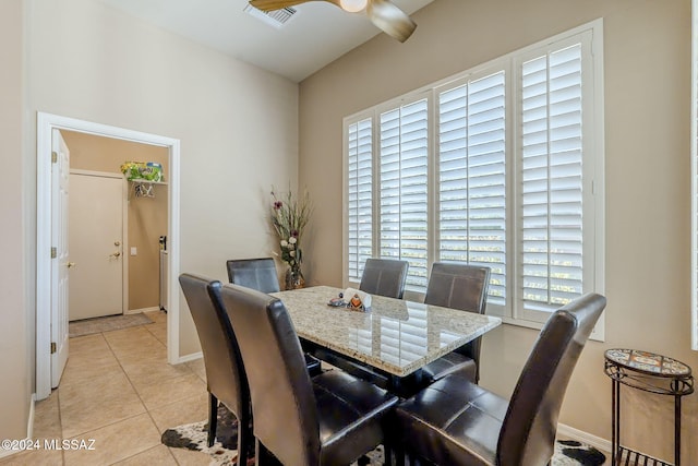 dining area with plenty of natural light, light tile patterned flooring, and ceiling fan