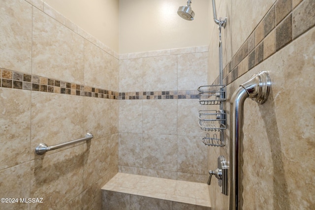 bathroom with a tile shower