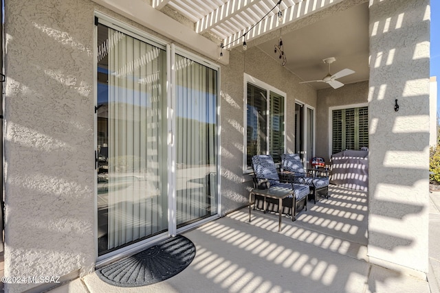 view of patio featuring ceiling fan