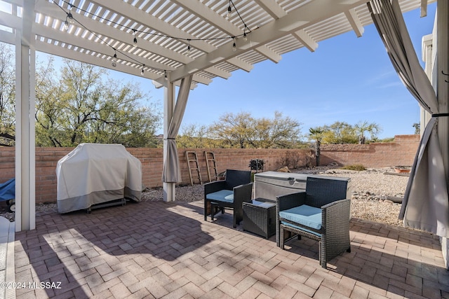 view of patio / terrace featuring a pergola and a grill