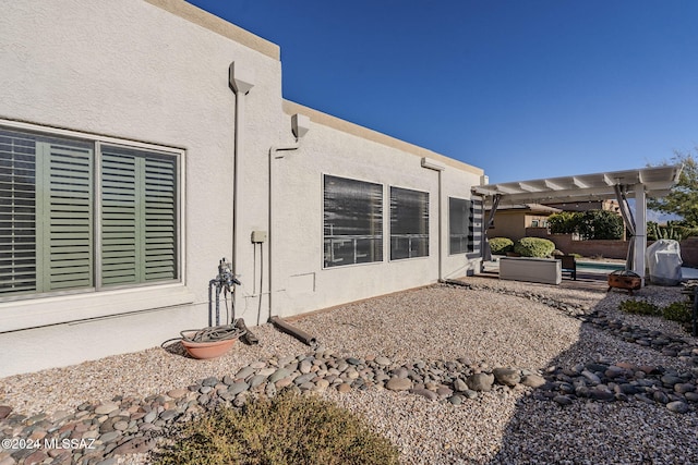 exterior space featuring a pergola and a patio