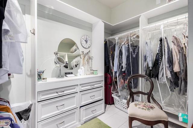 spacious closet with light tile patterned floors