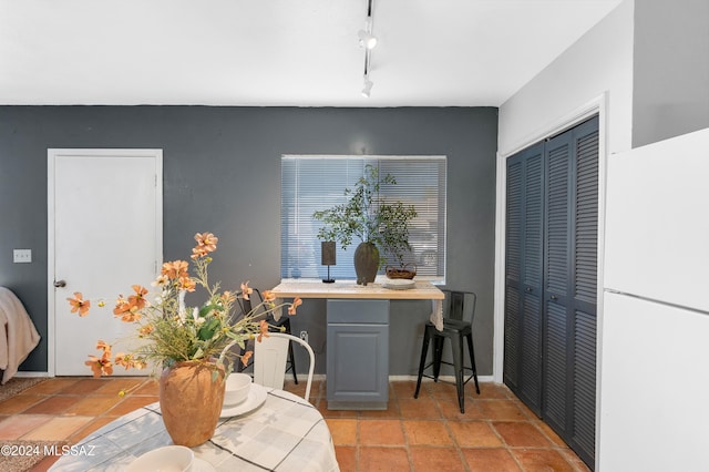 dining area with track lighting