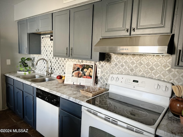 kitchen featuring white appliances, sink, backsplash, and gray cabinetry