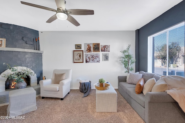 living room with ceiling fan and carpet flooring