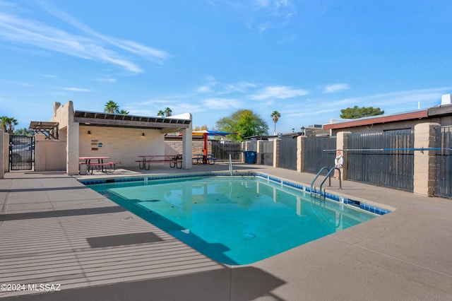 view of pool featuring a patio area