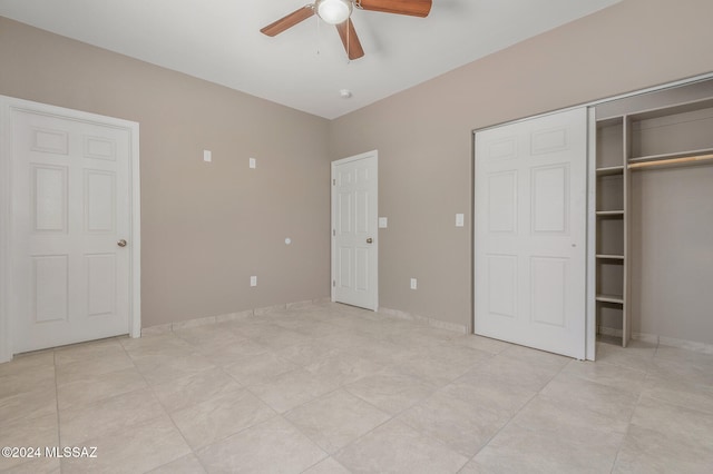 unfurnished bedroom with ceiling fan, a closet, and light tile patterned floors