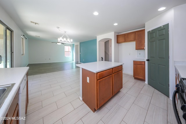 kitchen with an inviting chandelier, dishwasher, a center island, black range with electric stovetop, and hanging light fixtures