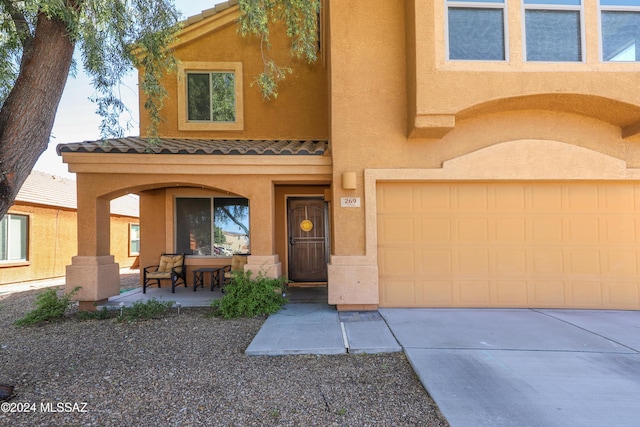 view of front of property with a garage