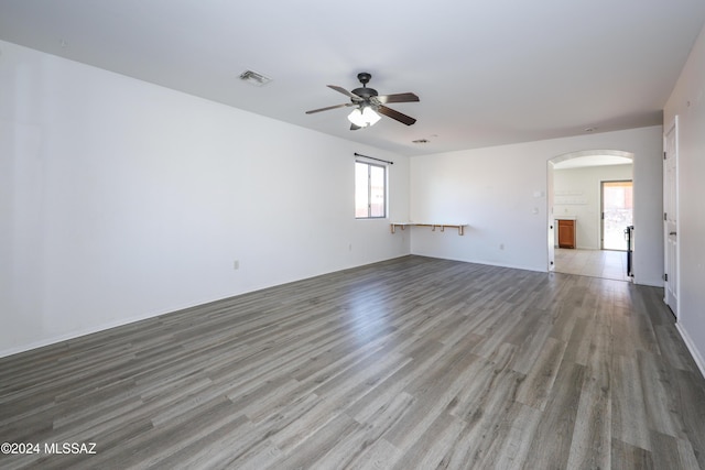 spare room featuring ceiling fan and hardwood / wood-style floors