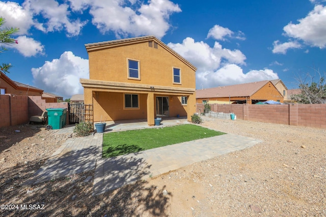 rear view of house featuring a patio area