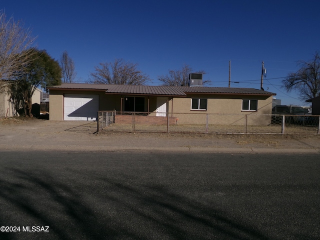 single story home with a garage