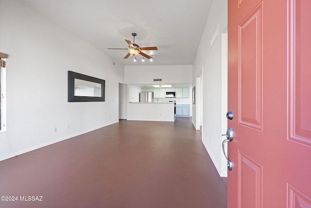 unfurnished living room featuring ceiling fan