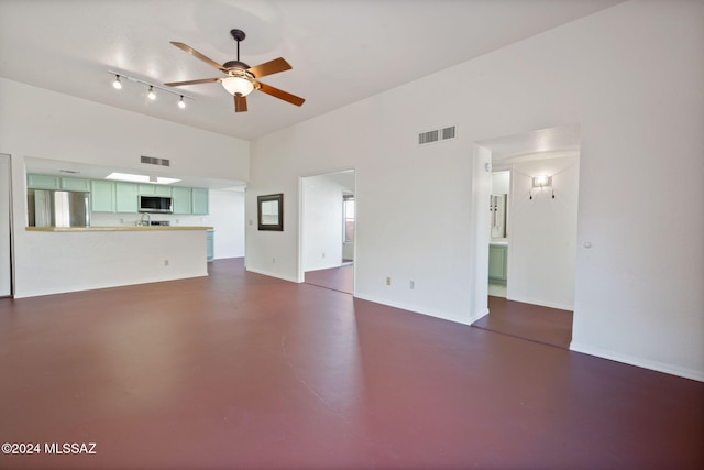 unfurnished living room featuring ceiling fan