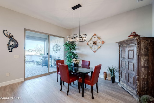 dining space featuring hardwood / wood-style flooring