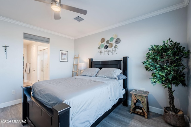 bedroom featuring hardwood / wood-style floors, ceiling fan, ornamental molding, and ensuite bathroom