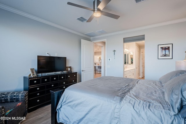 bedroom featuring wood-type flooring, ensuite bath, ceiling fan, and crown molding