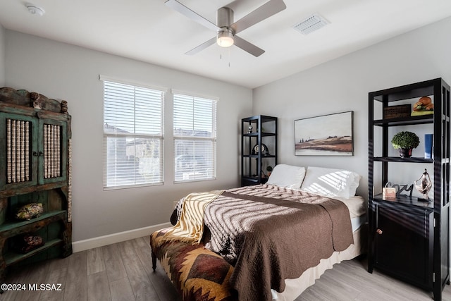 bedroom featuring ceiling fan and light hardwood / wood-style flooring