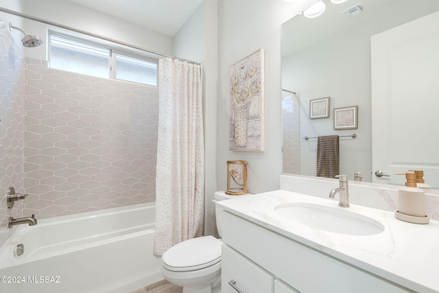 full bathroom with shower / bath combo, toilet, and vanity