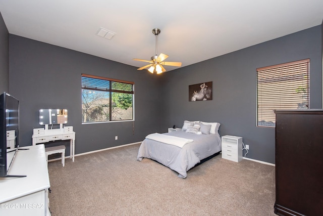 bedroom with ceiling fan and carpet floors