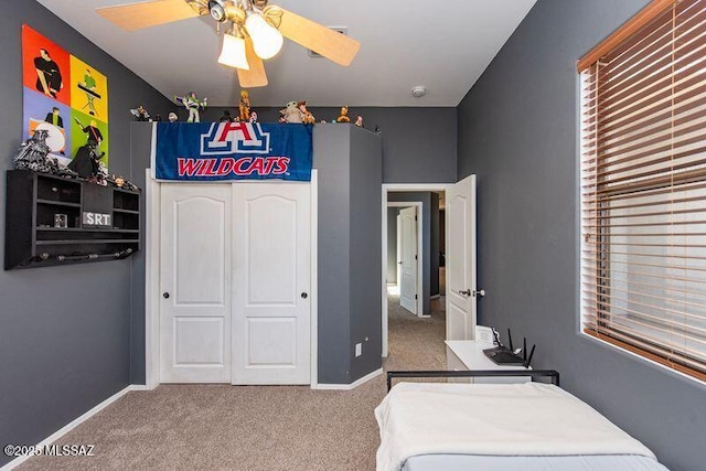 bedroom featuring carpet floors, a closet, and ceiling fan